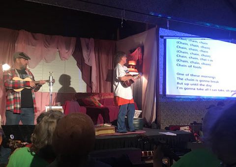 PETE-GAVIN-AS-UNCLE-SCRAGGY,-WITH-REBECCA-MORTON-AS-KARLA Projecting the singalongs